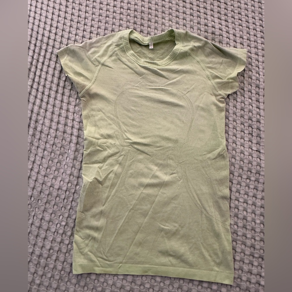 Lululumon Athletica- light yellow swiftly top